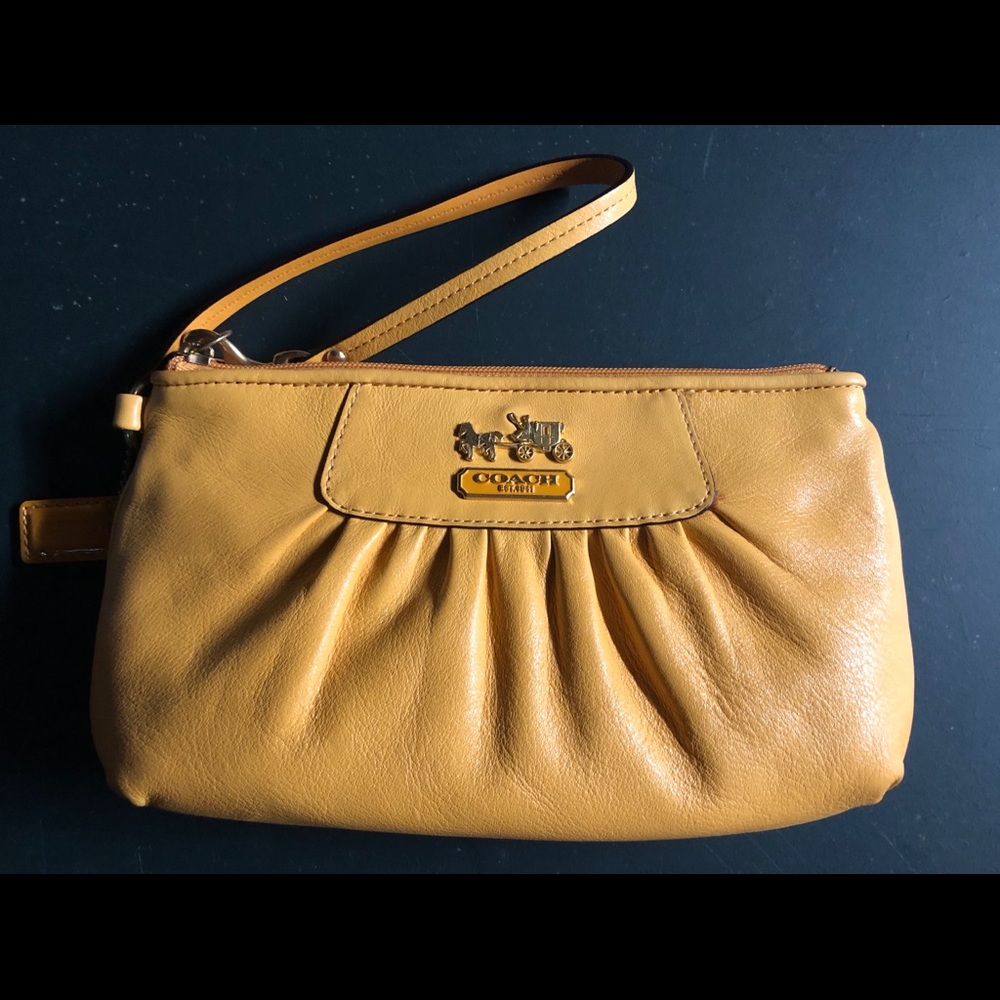 Like new Coach yellow leather wristlet
